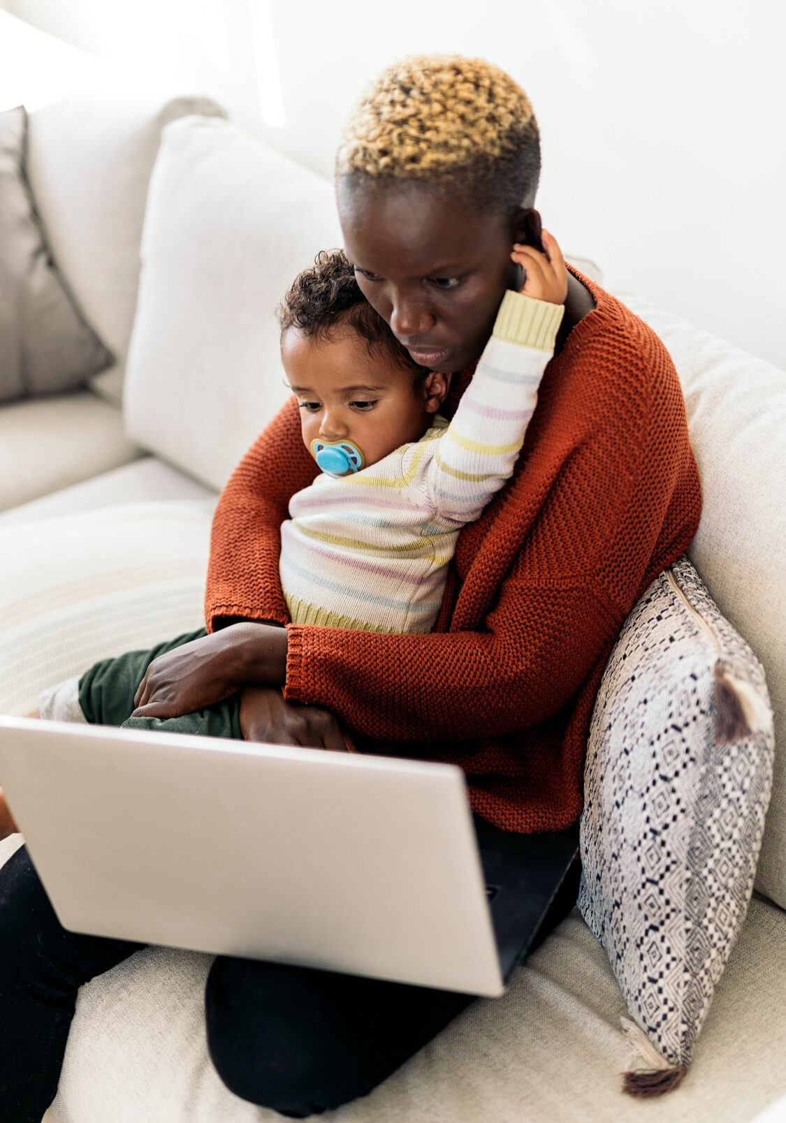 Mother and Daughter Surfing on the Internet with a laptop. Family concept.