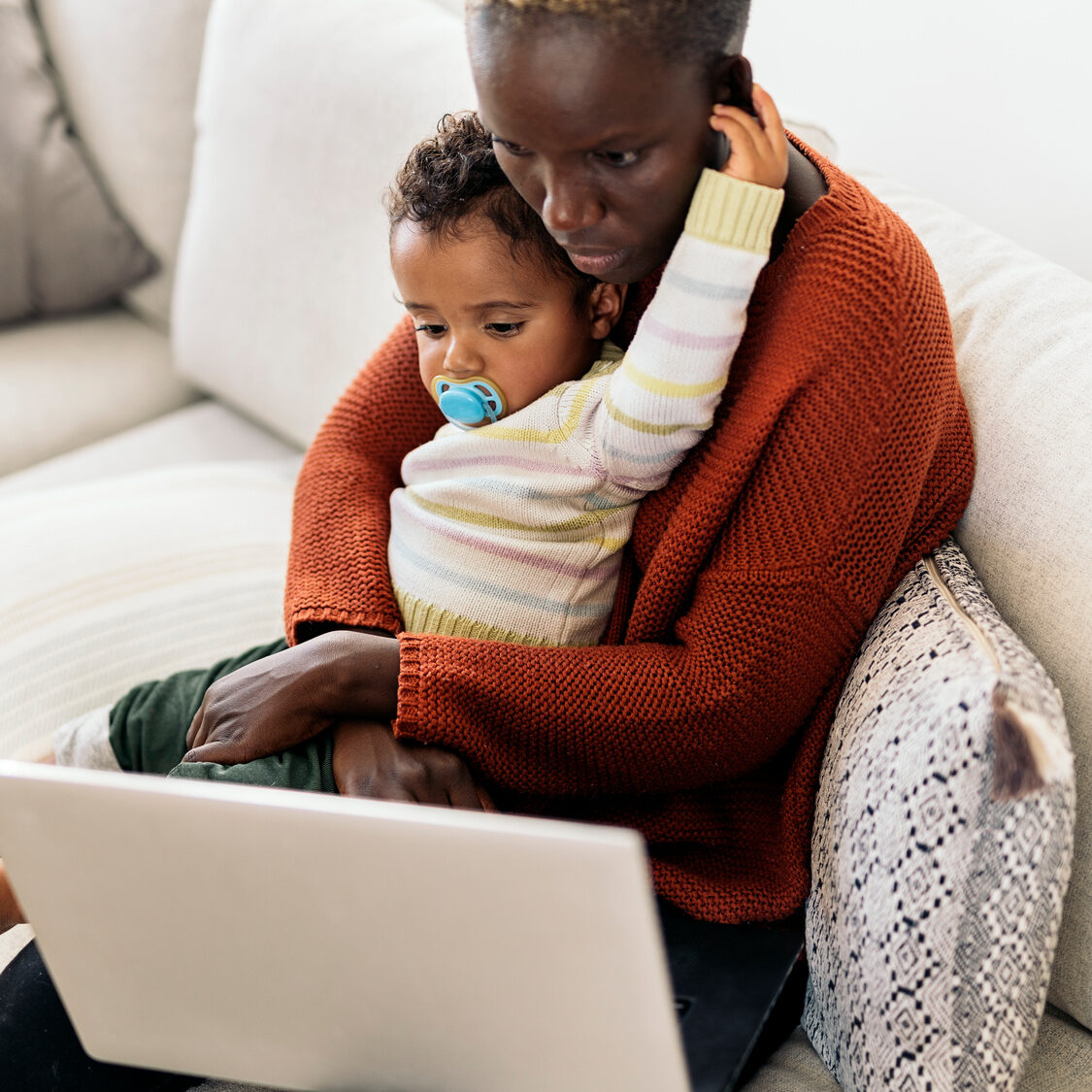 Mother and Daughter Surfing on the Internet with a laptop. Family concept.